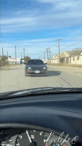 a car with a texas license plate driving down a street