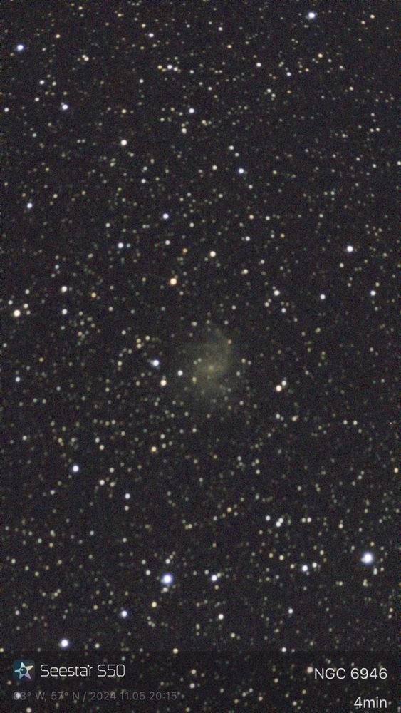 The fireworks galaxy (named NGC 6946).  The image shows lots of stars on a black aground and in the middle is a faint swirly galaxy.