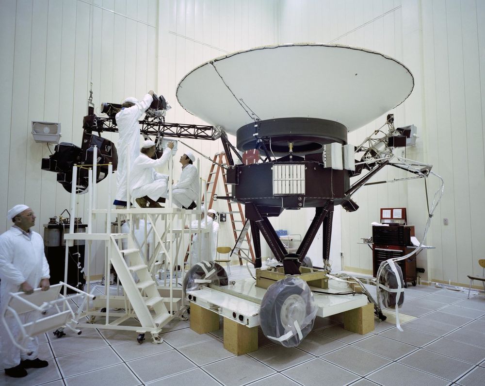 This image from March 23, 1977, shows engineers on stepladders preparing the Voyager 2 spacecraft ahead of its launch later that year. The spacecraft is the size of a small car with a big dish connected to a core which houses the instruments.

Credit: NASA/JPL-Caltech