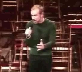 George Carlin showing his reaction to how gross he finds the inside of a tomato.