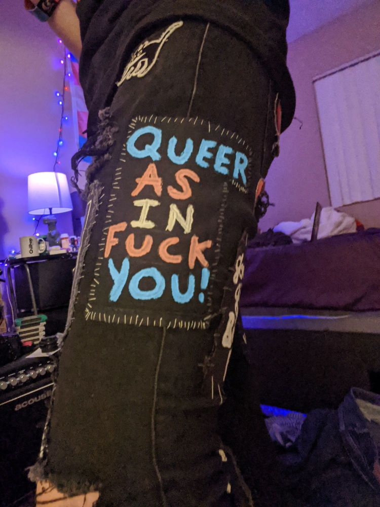 the queer as in fuck you! patch as it looks when I'm wearing the pants