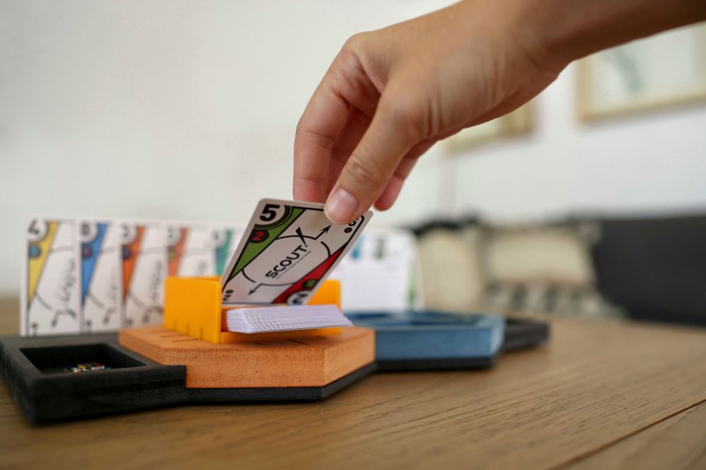 This is a Player One from Modern Meeple. With a deck hex and Scout the game.