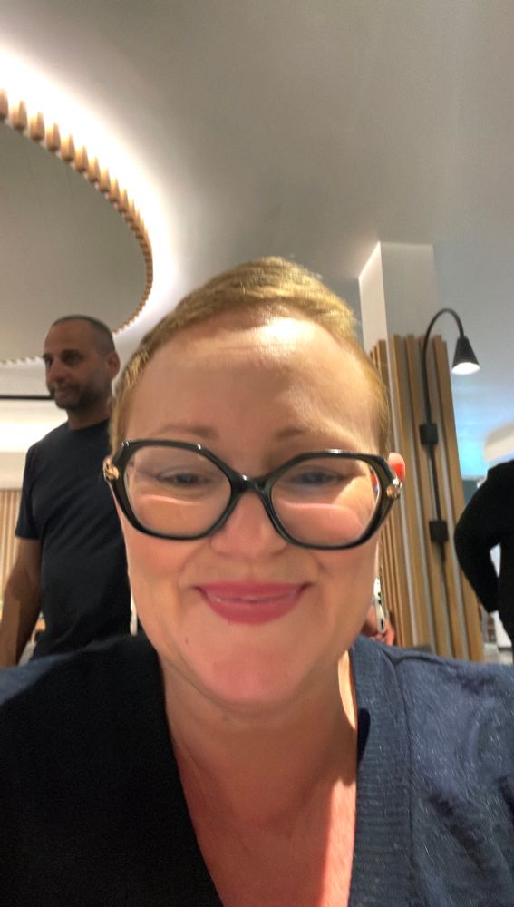 Photo of face with glasses. Big smile. 