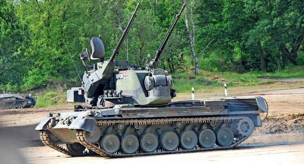 A German Flakpanzer Gepard, a self propelled AA gun on a training field.