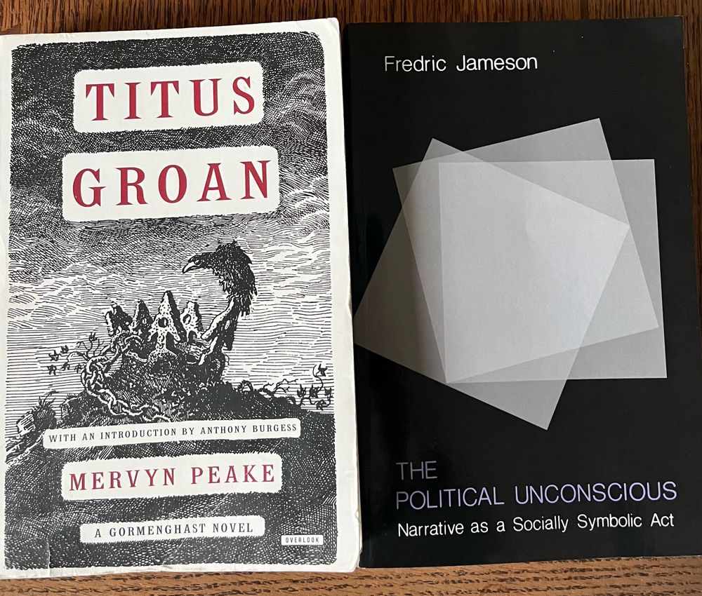 Two books side by side: “Titus Groan” by Mervyn Peake, and “The Political Unconscious: Narrative as a Socially Symbolic Act” by Fredric Jameson