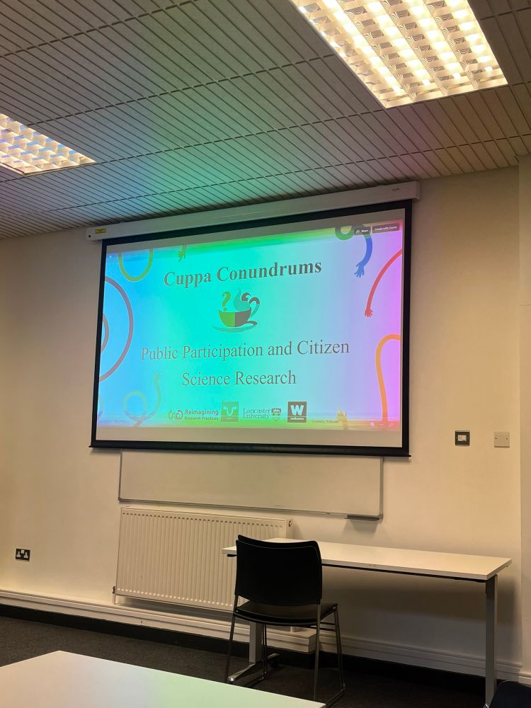 Photograph of welcome slide for the event which reads: ‘Cuppa Conundrums
Public Participation and Citizen
Science Research’