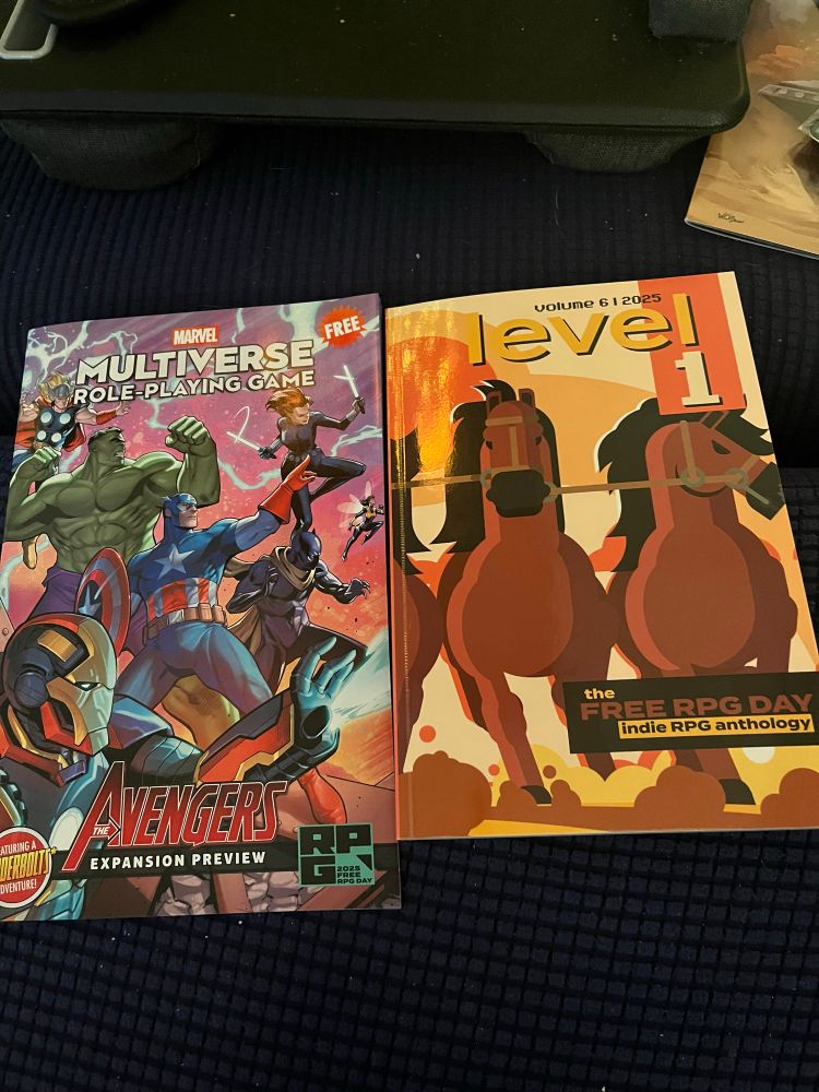 Free RPG day books Marvel Multiverse RPG Avengers Preview and Level 1 indie RPG anthology zine.
