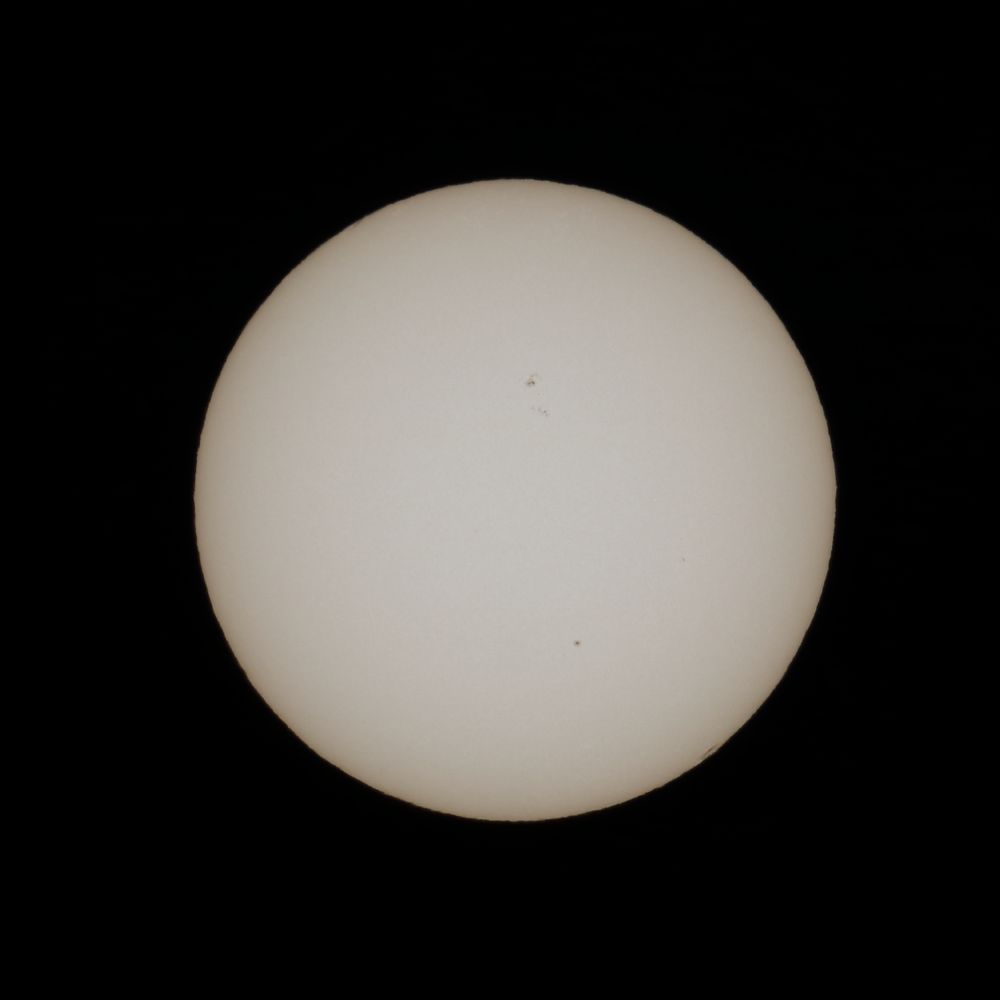 A picture of the sun, with a sun spots clearly visible. Taken with a 600mm telelense