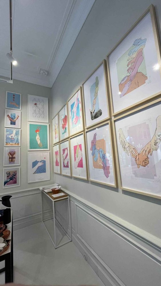 a collection of 18 of my works all displayed on a wall