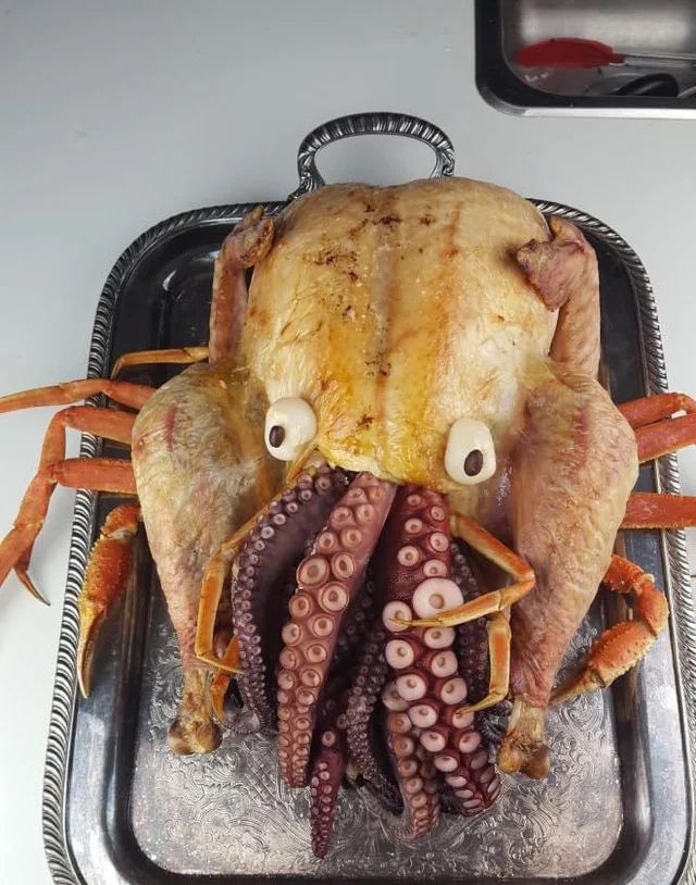 turkey stuffed with octopus tentacles, sitting on top of crab legs