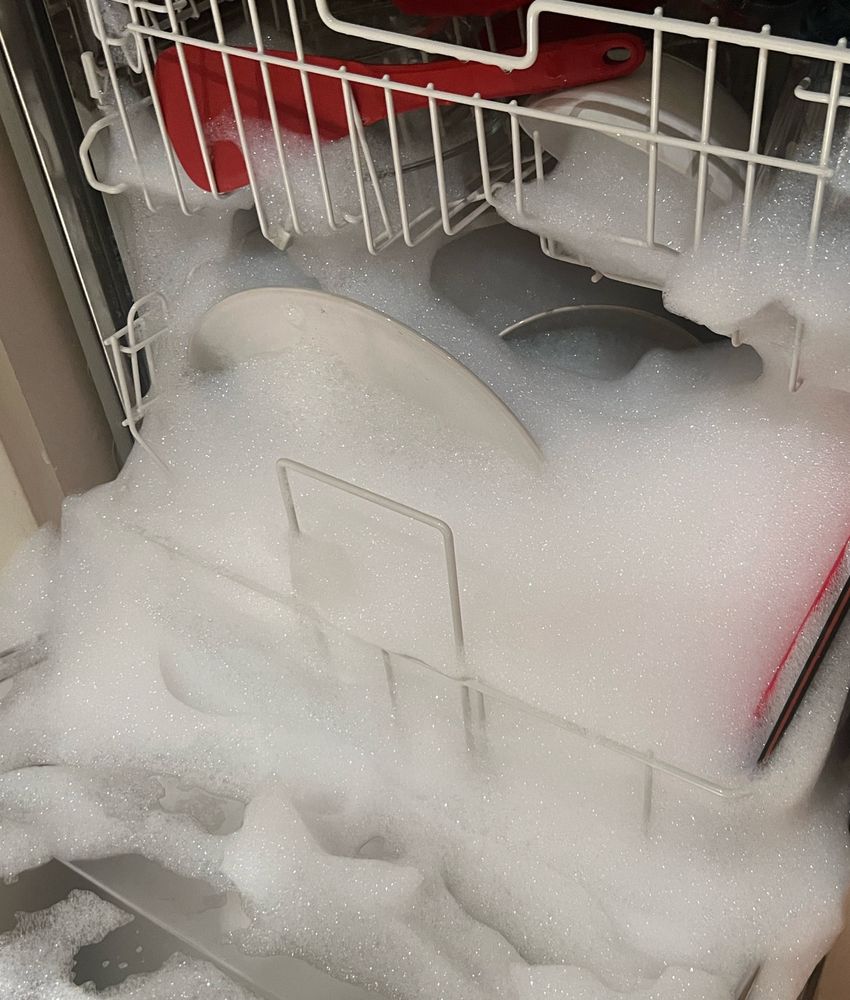 dishwasher with bubbles pouring out everywhere