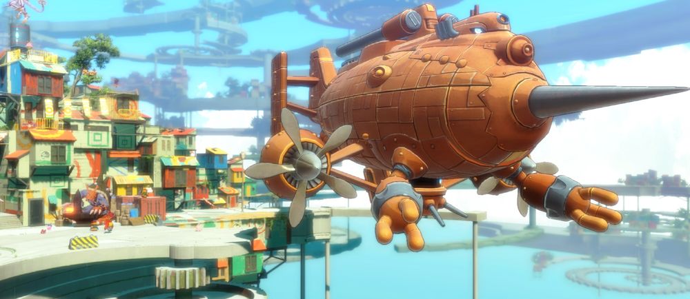 The image shows a video-game blimp parked beside a ramshackle shipping-container town, floating on platforms in what appears to be an open blue sky. The blimp is bronzed, with arms and eyes, suggesting some level of sentience.
