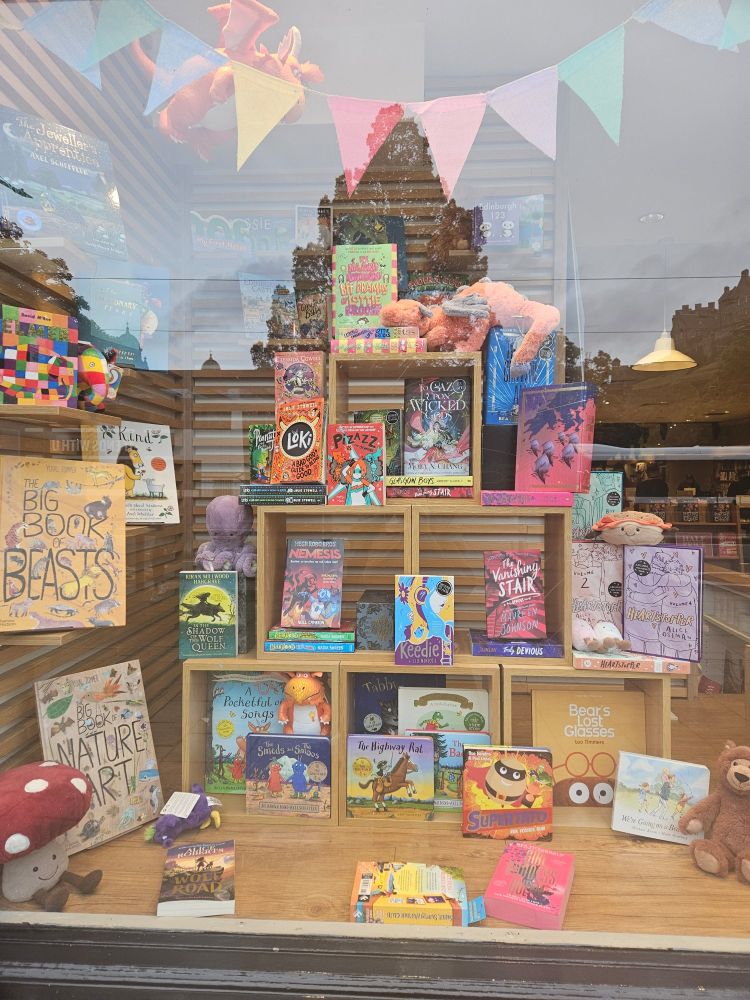 Bookshop window including Loki and mega robo bros