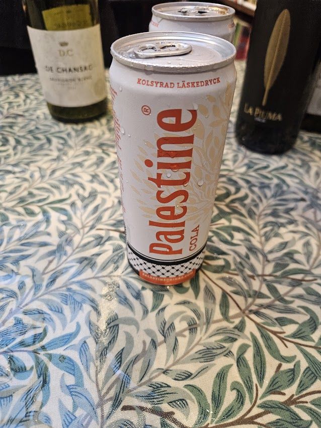 A can of Palestine cola on a drinks table at the launch
