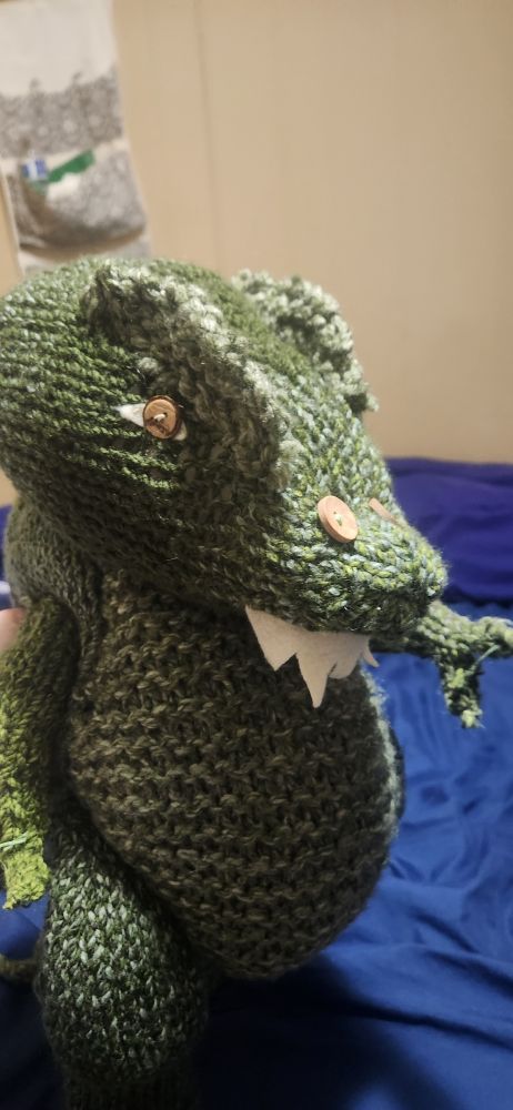 Green knitted allosaurus 