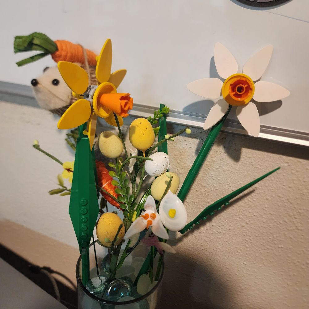 LEGO flowers with glass flowers,  Easter decorations, and a hedgehog sitting on a giant carrot (it's just a decoration)