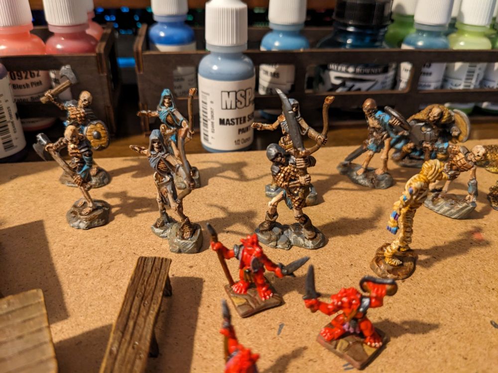 Painting progress on some Reaper Bones skeletons, kobolds, and mummies.