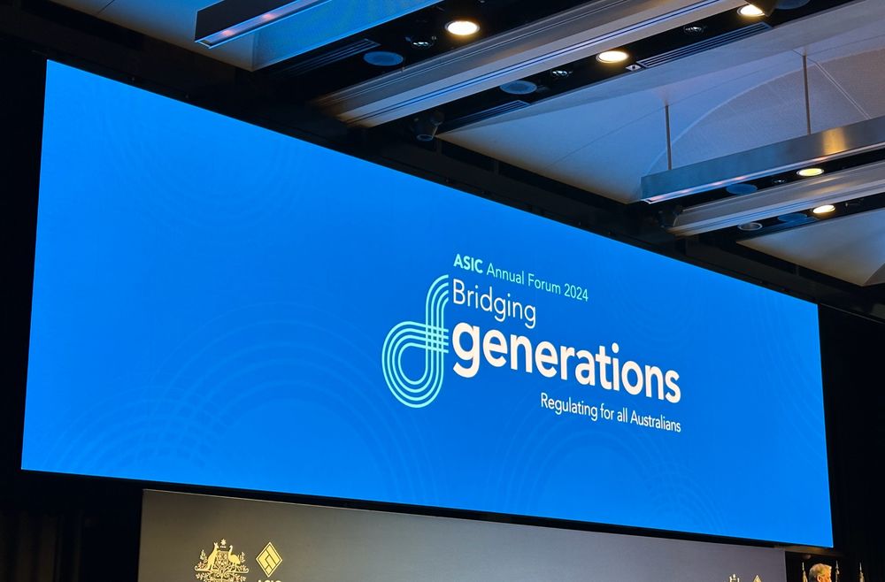 Bright blue sign with “ASIC Annual Forum 2024: Bridging Generations - Regulating for all Australians”