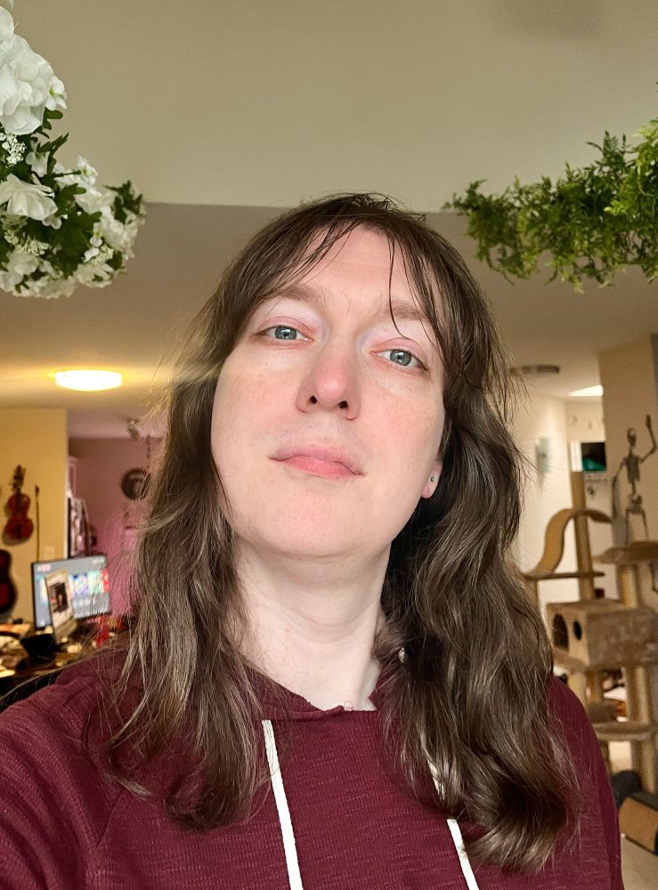 Selfie of me from this week. Long hair, little visible facial hair.