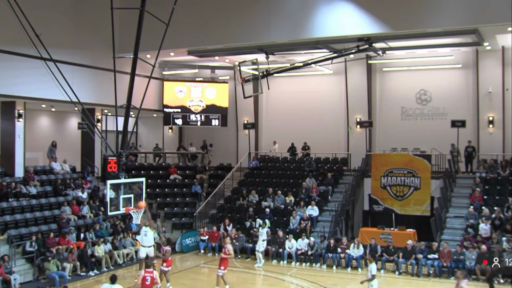 Screenshot of Bradley vs St Bonaventure Field of 68 game where only the top right corner of the court is shown from the center-court camera, as Frank Mitchell goes up to complete an alley-oop.
