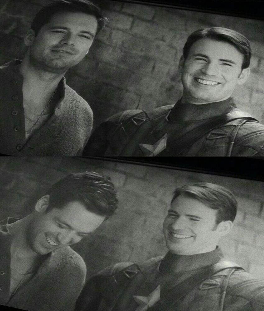 Steve Rogers and Bucky Barnes laughing and smiling together.