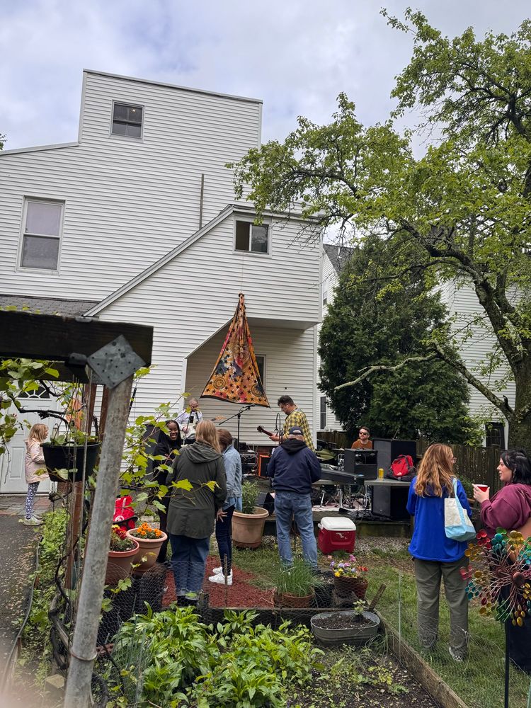 some vibes backyard area and stairwell with lots of plants and another band