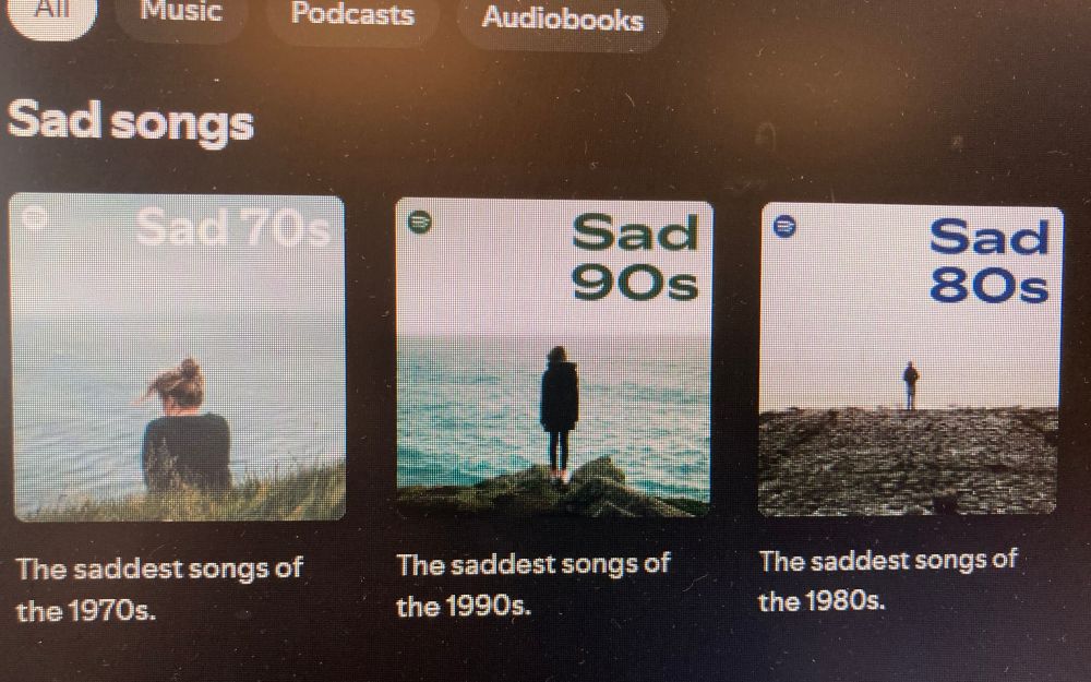 A screenshot of suggested playlists from Spotify of sad songs. Sad 70s, Sad 90s and Sad 80s. Does this mean Spotify is diagnosing me with depression because of my recent song choices? What the hell. 