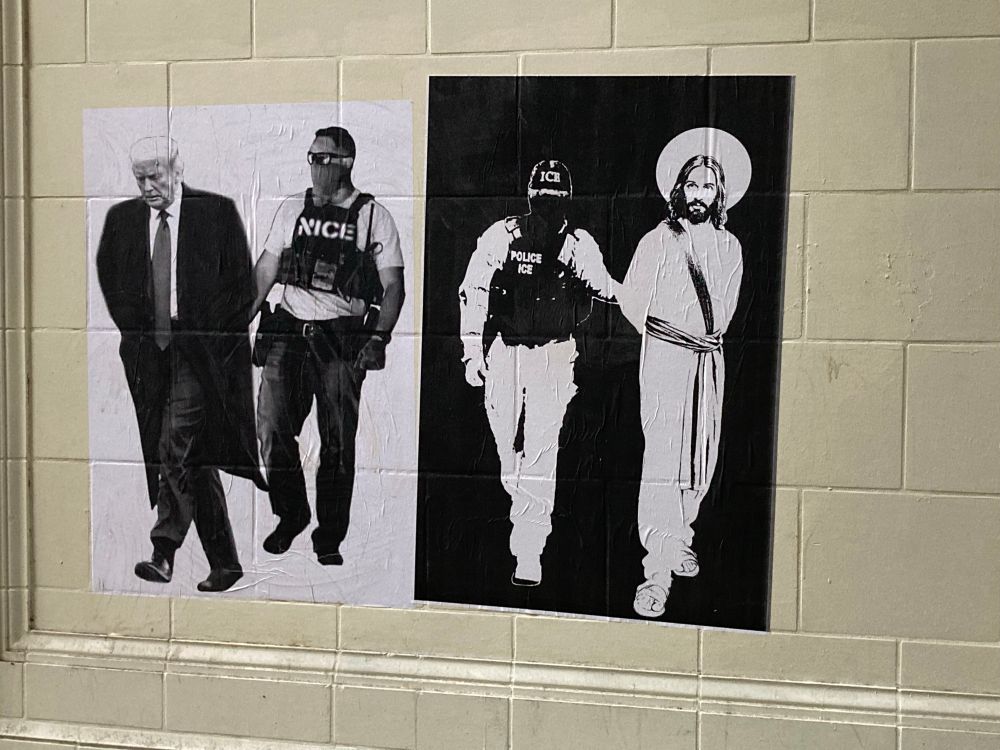 Street art in downtown Seattle depicting ice agents arresting Jesus and the orange idiot.