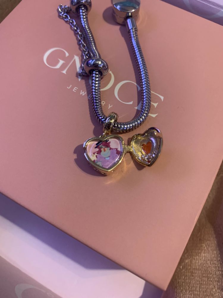 Another picture of the locket, this time opened and revealing a small picture of Dr Habit from Smile for Me