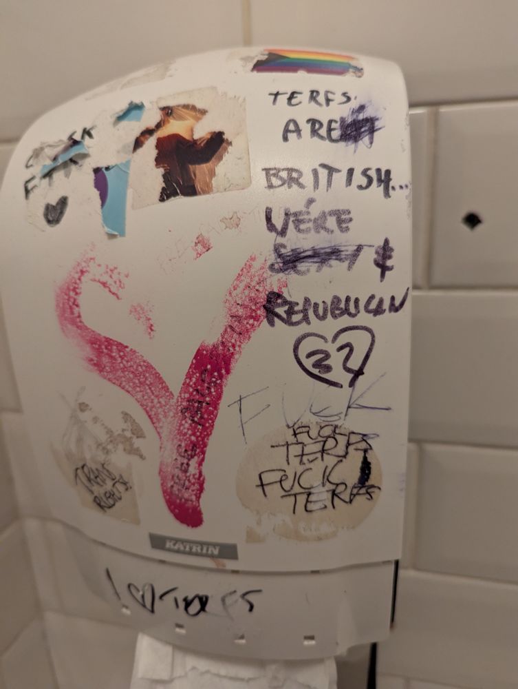 Toilet roll dispenser graffiti saying "terfs aren't British" but it's altered to say "terfs are British...were republican"