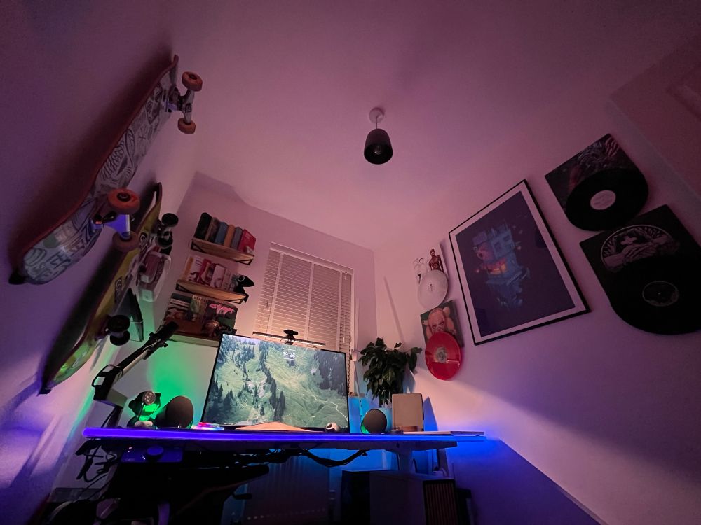 A low shot of the office walls, with skateboards and vinyl on the walls. Featuring Space Goose’s “Space Ramen” print in the centre.