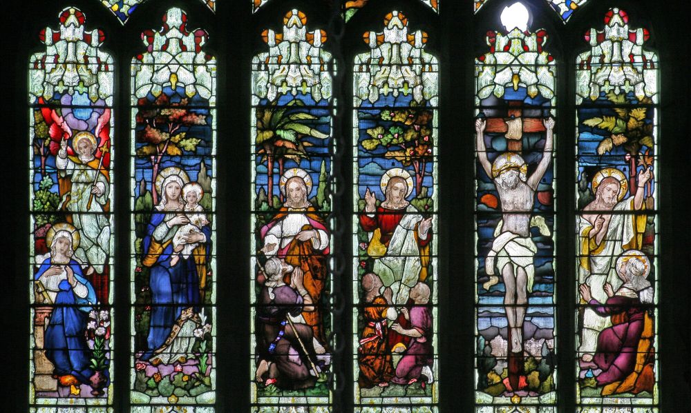 Stained glass window at St. Michael and All Angels, Princetown showing 6 scenes from the bible, from left to right: Annunciation, Virgin and Child, Jesus performing miracles, Jesus and the children, Crucifixion, Ascension or Easter (c) Jen Bryant