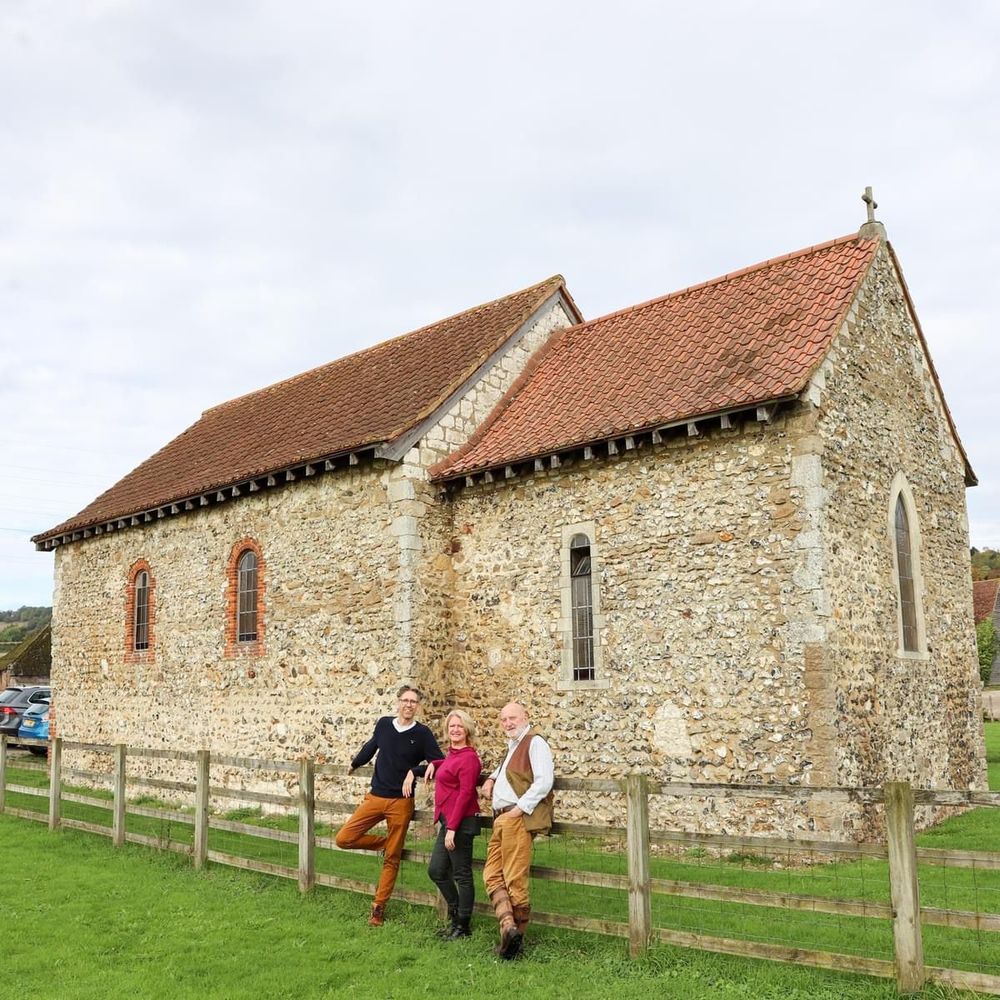 The Friends of St. Benedict's Paddlesworth posing for a photo outside the church.