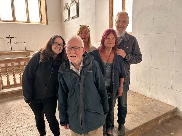 The Wolfhampcote team posing for a picture inside the church