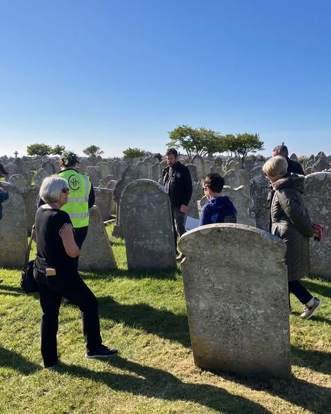 A group of volunteers on a sunny day in the churchyard at St. George's Portland
