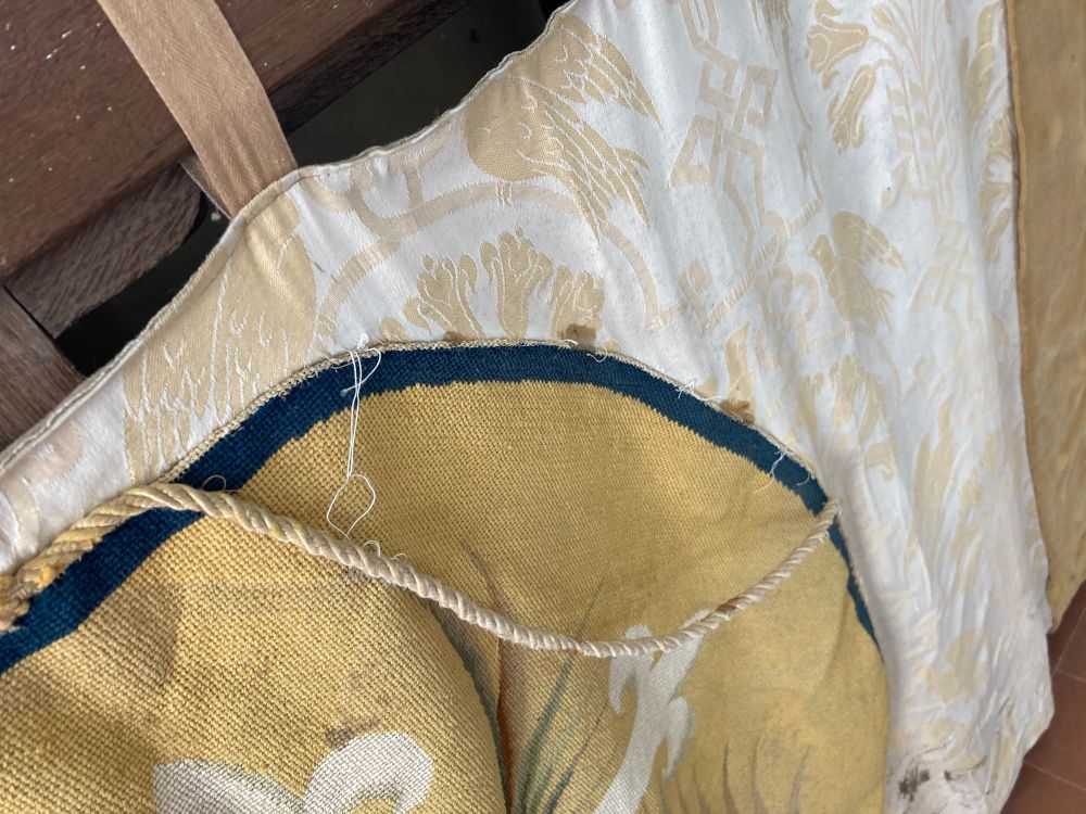 Close up of the altar frontal showing a loose cord.