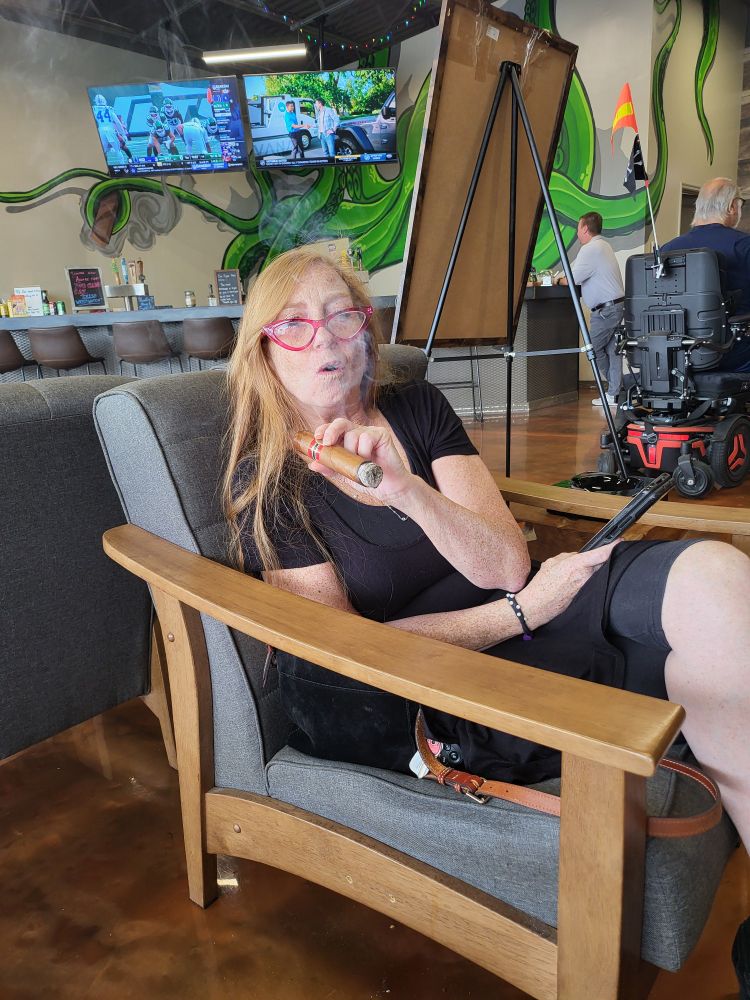 Jill smokes a cigar like a pro. 