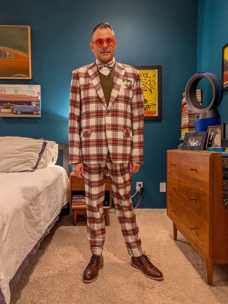 Serving high faggotry in a very Christmas-y Mr. Turk suit with matching bow tie, green rabbit hair vest that, like me, I bought new but is now old enough to count as vintage, bright red Theo glasses and brown shoes from Helm 