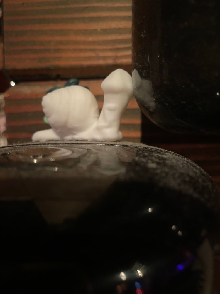 Small 3D print of a snail with a dick for a head