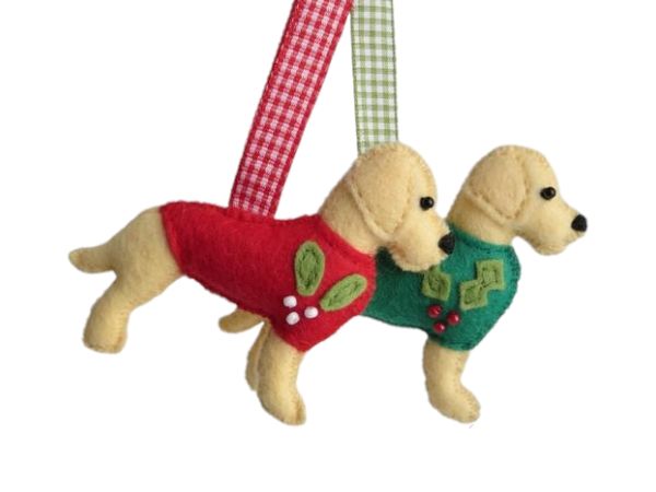 A pair of felt handmade yellow labrador retriever christmas ornaments by misheleneous. They are wearing a red mistletoe and green holly motif festive jumper with coordinating gingham hanging ribbon
