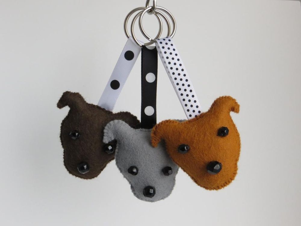 A trio of different coloured staffordshire bull terrier dog breed head keyrings by misheleneous