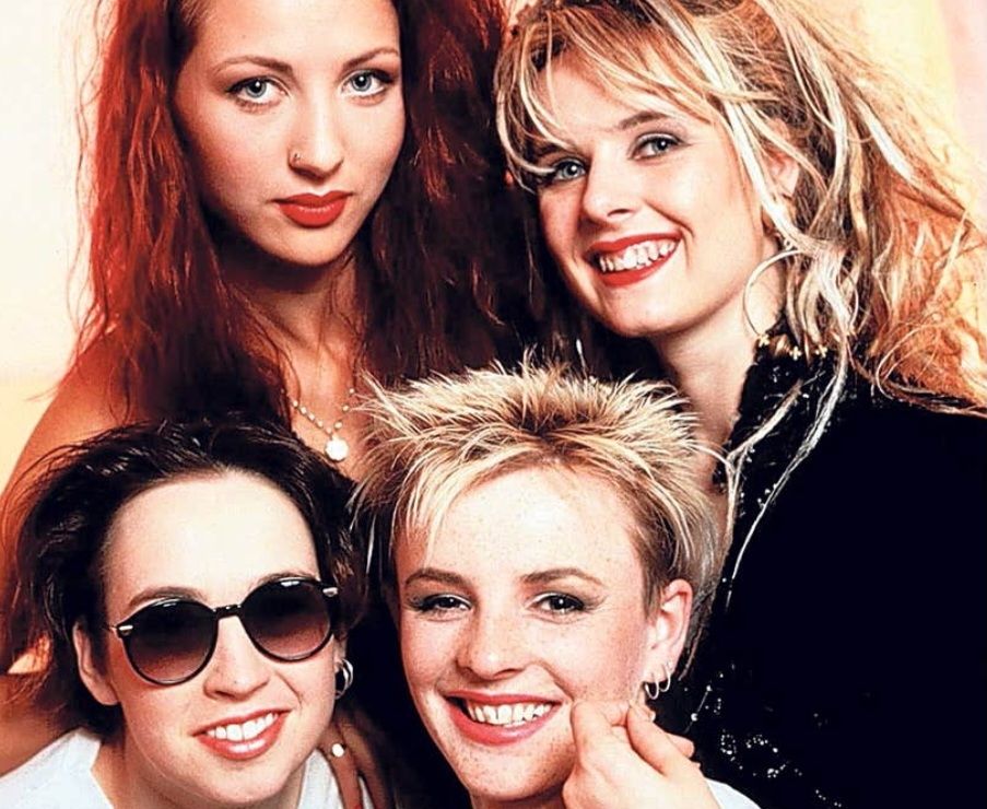 Screenshot of a We've Got A Fuzzbox And We're Gonna Use It band photo taken from Drummer Tina O'Neil's idmb profile: https://m.imdb.com/name/nm6241791/