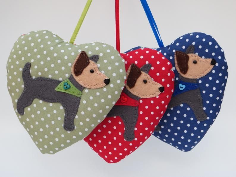 A trio of spotty green, red and blue fabric heart lavender filled ornaments by misheleneous. Featuring a hand sewn felt yorkshire terrier motif on each different colour