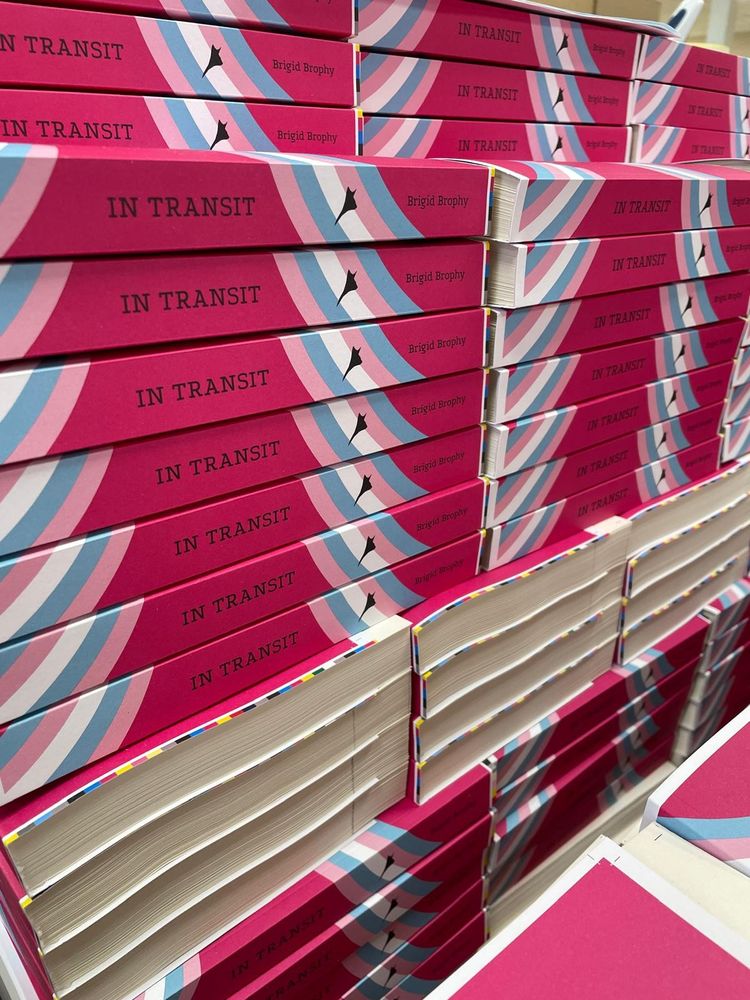 Stacks of untrimmed copies of In Transit by Brigid Brophy in a warehouse published by Lurid Editions May 2025 