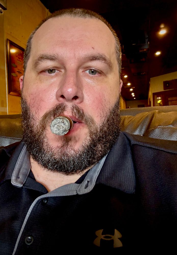 Bearded Dad enjoying a cigar while working