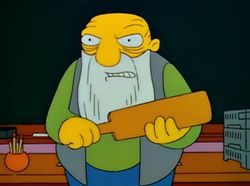 Jasper from the Simpsons holding his paddle looking angry