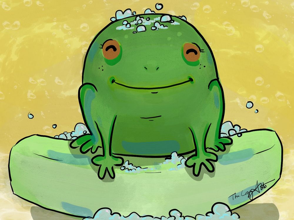 a very round, smiling frog sits on a bar of soap surrounded by bubbles