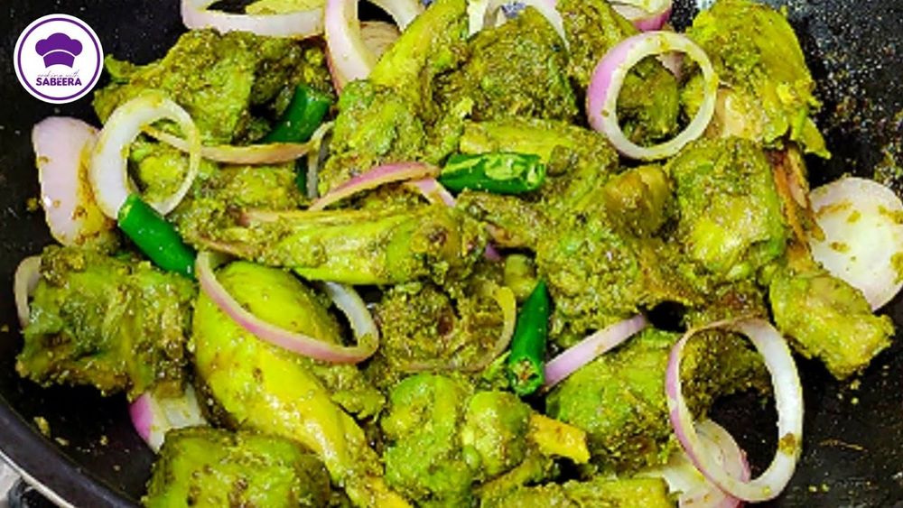 a plate of fried chicken and mixed veggies dyed green 
