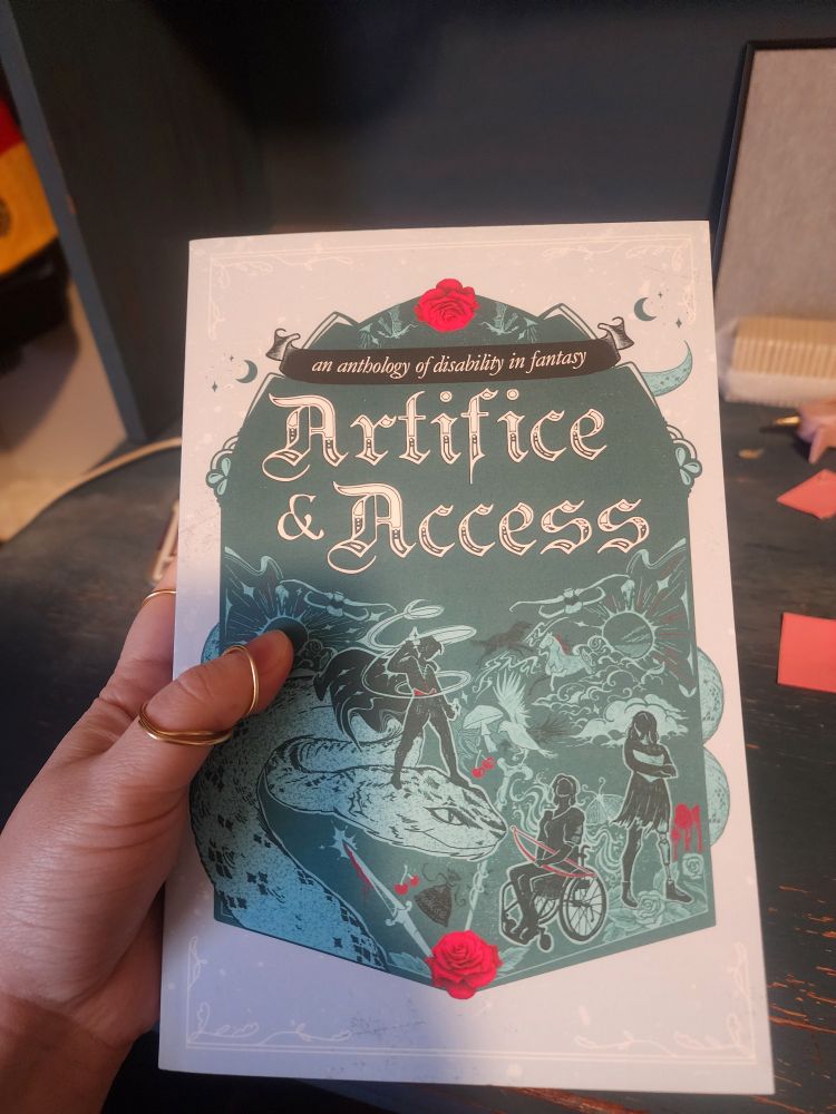 A picture of the cover of the book Artifice & Access, a teal cover depicting heroes in various positions, including one with a prosthetic leg and one in a wheelchair.