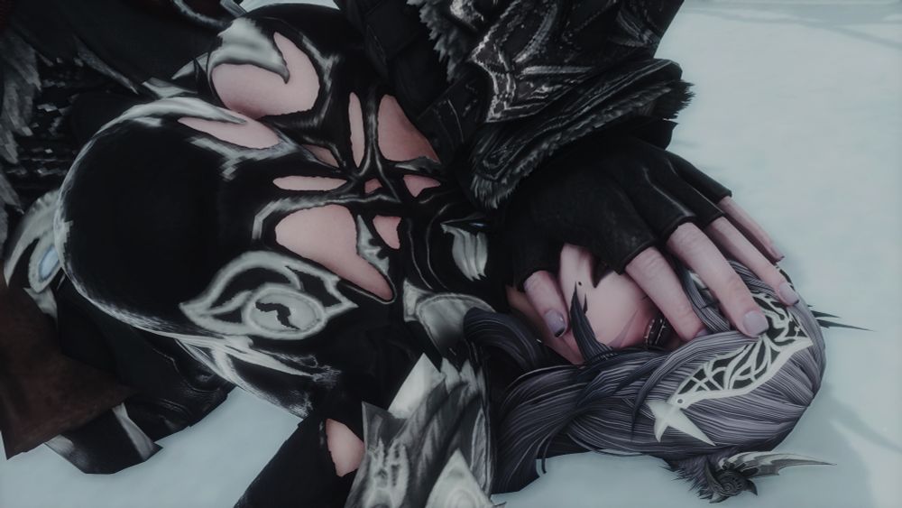 Close-up of Lidiya with Vakaras's hand on their face.